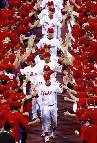 Sport: 24 hours: The Philadelphia Phillies enter the field before their opening game
