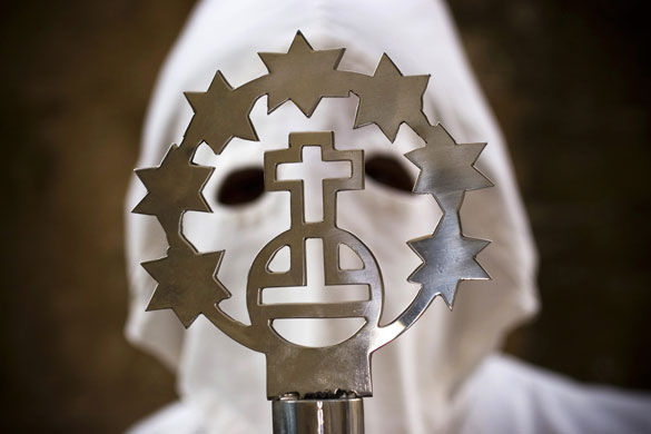 6 April 2009: Palma de Mallorca, Spain: A penitent takes part in a Palm Sunday procession