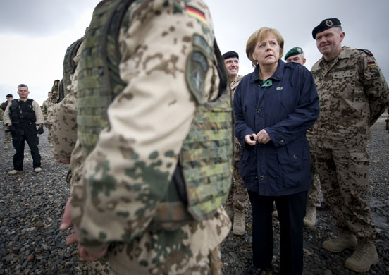 6 April 2009: Kunduz, Afghanistan: Angela Merkel stands with members of the German army