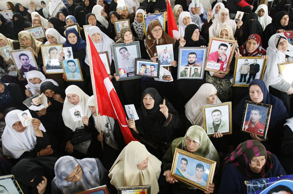 6 April 2009: Gaza Strip: Women hold portraits of jailed relatives during a protest