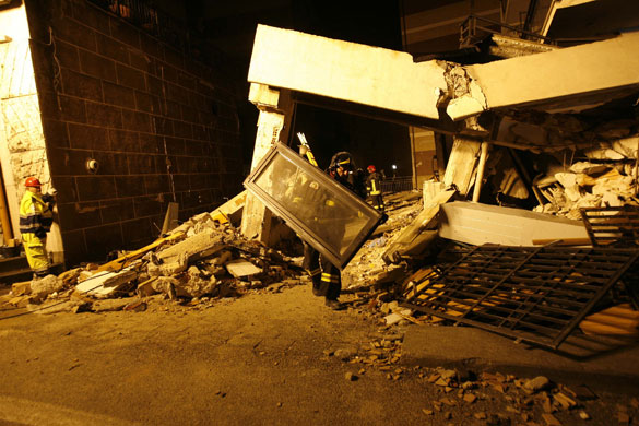 L'Aquila earthquake: Italian firefighters work on the collapsed university dorm building