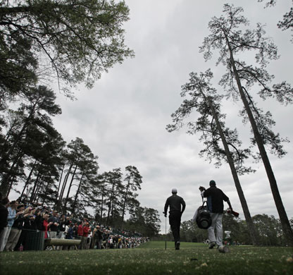 Sport: 24 Hours: Tiger Woods and his caddie Steve Williams walk down the fairway in Augusta