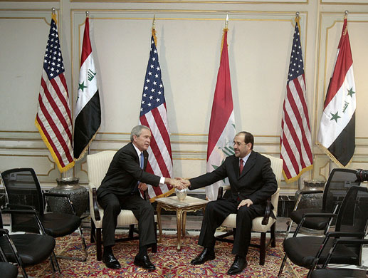 Visits to Iraq: 13 June 2006: George Bush shakes hands with prime minister Nuri al-Maliki