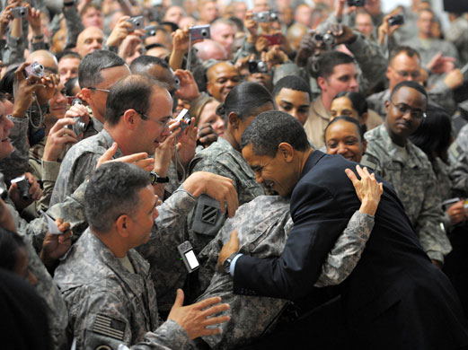 Visits to Baghdad: Barack Obama greets troops during a visit to Camp Victory