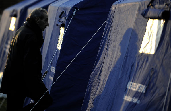 Earthquake aftershock: A man at a camp in L'Aquila