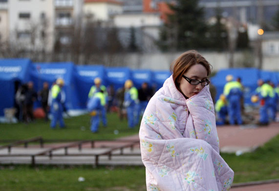 Earthquake aftershock: A woman at a makeshift tent camp in L'Aquila