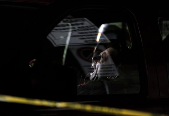 Earthquake aftershock: A firefighter yawns as he takes a rest in L'Aquila