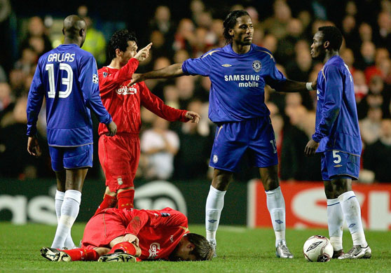 Liverpool v Chelsea: Chelsea's Essien is pushed away by Drogba