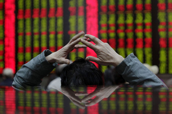 8 April 2009: Shanghai: A man at a brokerage house