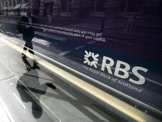 Week in Business: A man is walks past a Royal Bank of Scotland (RBS) branch in London.