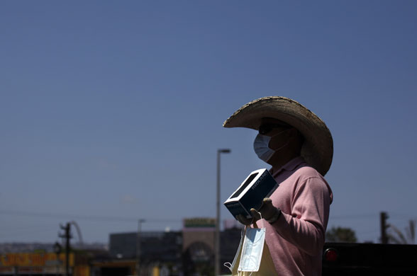 Mexico swine flu: A street vendor surgical masks at the San Ysidro Crossing in Tijuana.