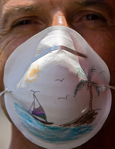 Swine flu face masks: A man wears a decorated mask in Mexico City