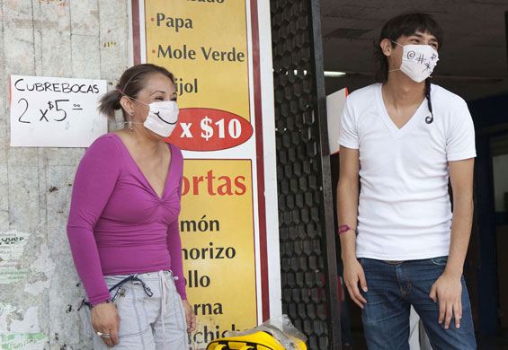 Swine flu face masks: Residents wearing customised surgical masks in Mexico City