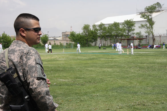 Afghanistan cricket: A soldier watches a cricket match 
