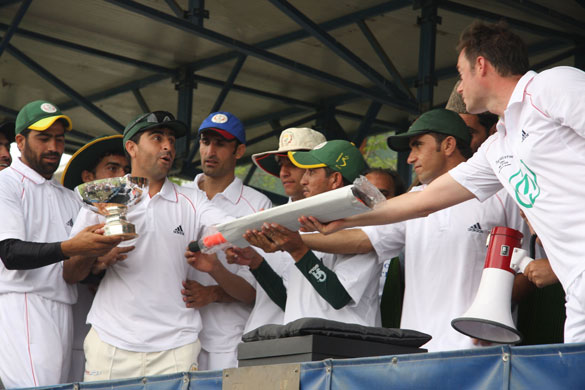 Afghanistan cricket: A cricketer from Afghanistan's cricket team is presented with a bat