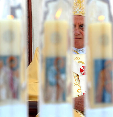 24 hours in pictures: Amman, Jordan: Pope Benedict XVI looks on as he celebrates Sunday Mass 