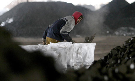 A worker collects coal in Bulgaria