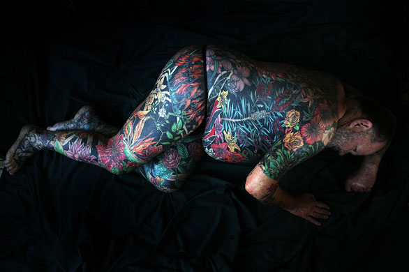 24 hours in pictures: Tattooed Man Geoff Ostling To Donate His Skin To Art Gallery