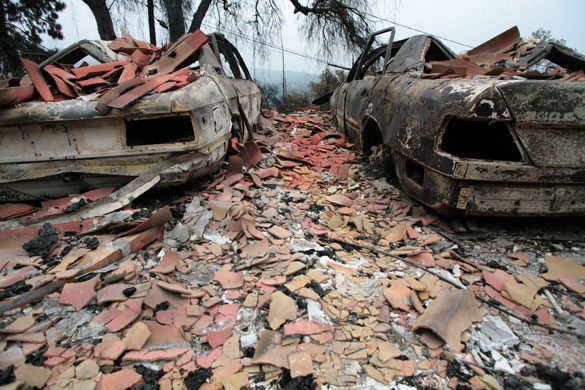 24 hours in pictures: The charred hulls of two Mercedes cars after teh California wildfires