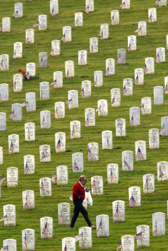 gravestone: Flags on the graves at National Cemetery, California