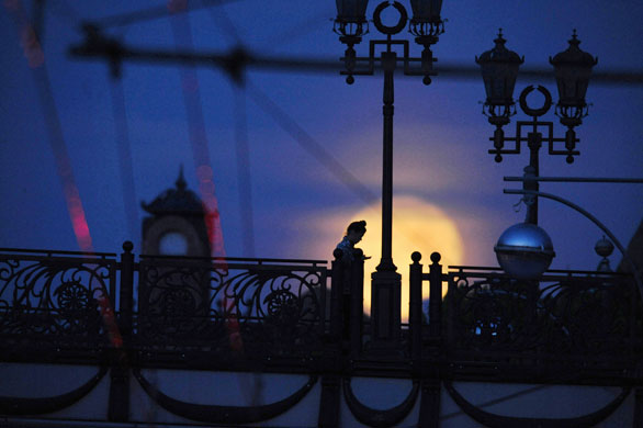 12 May 2009: Moscow, Russia: A girl stands on a pedestrian bridge