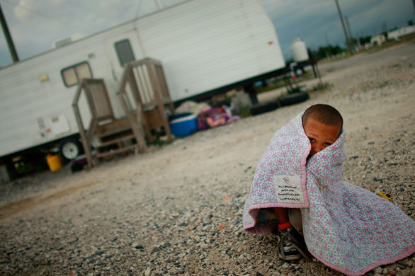 12 May 2009: Port Sulphur, US: Herschel Barthelemy sits outside the trailer he lives in