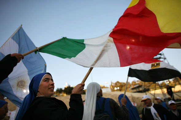 Pope Benedict XVI: Catholic nuns wave their national flags