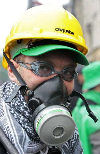 ArcelorMittal: A demonstrator wears a gas mask during the protest