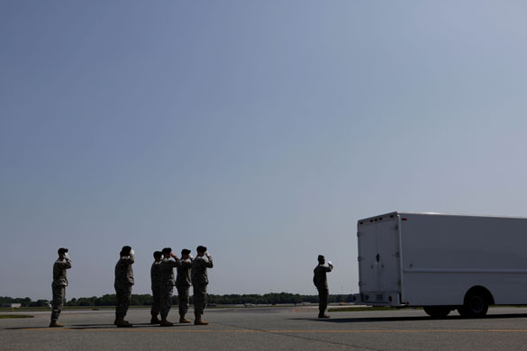 24 hours in pictures: vehicle containing US soldiers killed in Iraq and Afghanistan