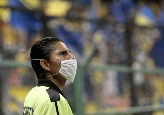 weird sport: A security guard wears a surgical mask
