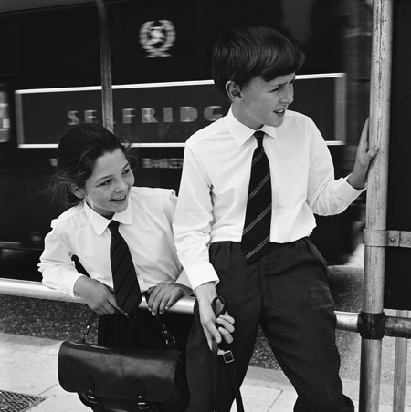 School uniforms: Two schoolchildren in brilliant white shirts outside Selfridges, 1964.