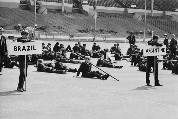 School uniforms: 1966: Schoolboys at Wembley Stadium during a rehearsal for the World Cup 