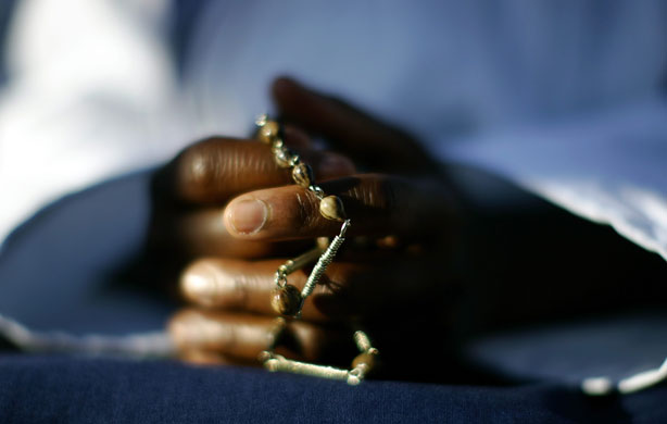 14 May 2009: Bethlehem, West Bank: A nun holds a rosary