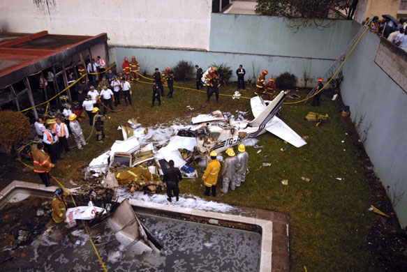 15 May 2009: Guatemala: Rescue forces work on the site where a twin-engine plane crashed