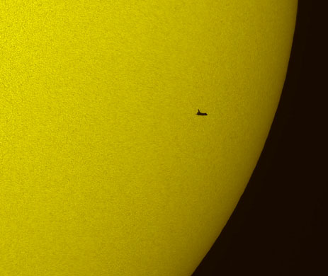 15 May 2009: The NASA space shuttle Atlantis in silhouette during solar transit