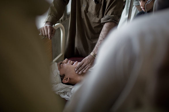 24 hours in pictures : car bomb blast in peshawar kills 11