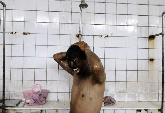24 hours: A chinese coal miner takes a shower after his shift 