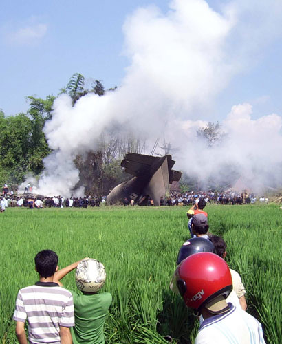 Indonesian plane crash: Rescuers at the crash site of a military transport plane in Magetan