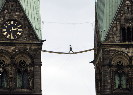 20 May 2009: Bremen: A man walks over a bridge between the towers of the cathedral