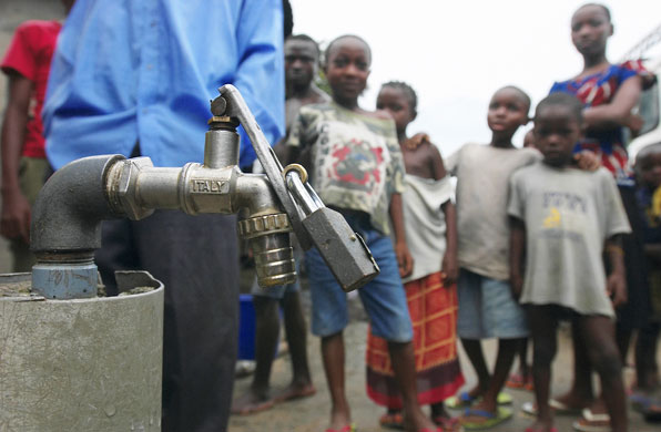 Shell in the Niger Delta: A privately owned water tap is locked in Port Harcourt, Nigeria