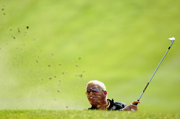 24sport: John Daly smokes a cigarette whilst playing from a bunker