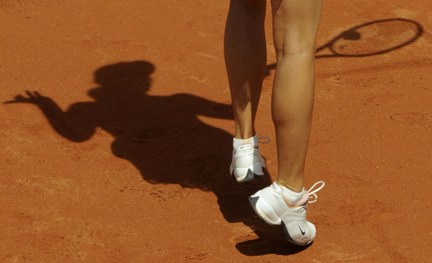 24sport: Maria Sharapova is silhouetted on the clay 
