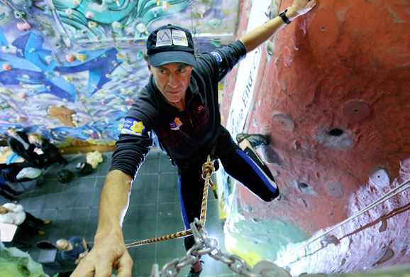 Sir Ranulph Fiennes: Sir Ranulph Fiennes scales a climbing wall in East London