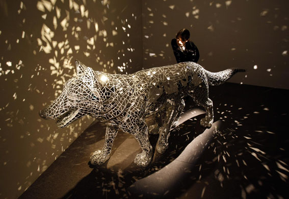 21 May 2009: Tokyo, Japan: A wolf sculpture covered with mirrors at an exhibition