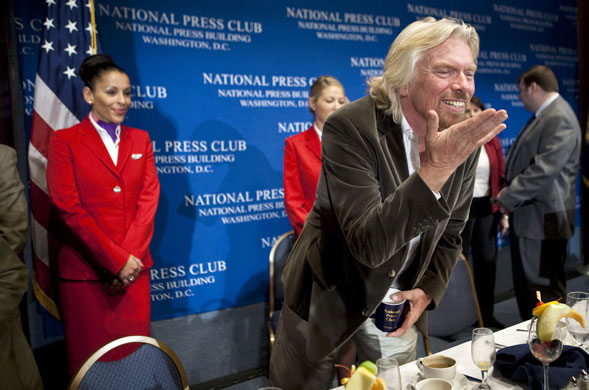 Week in Business: Virgin Group Chairman Richard Branson blows a kiss at National Press Club.