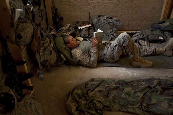 Sean Smith in Afghanistan: An American Army soldier reads in the sleeping quarters at FOB Tarwah.