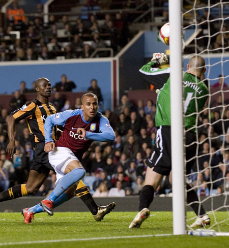 Relegation timescale: Gabriel Agbonlahor's shot is saved by Hull City's Boaz Myhill