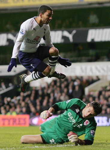 Relegation timescale: Aaron Lennon jumps over Middlesbrough Goalkeeper Brad Jones 
