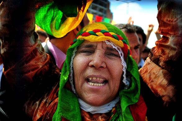 24 hours in pictures: Istanbul, Turkey: A Kurdish woman chants at a Democratic Society meeting. 