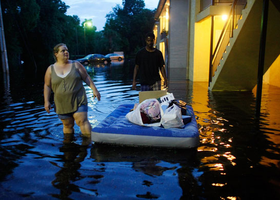 24 hours in pictures: Daytona Beach, Florida, USA: people move belongings out of floods